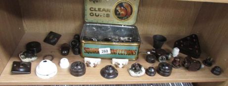 A shelf of vintage electric fittings etc.