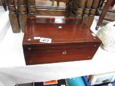 A mahogany box with mother of pearl inlay,