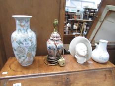 A table lamp, vase and 2 other items.