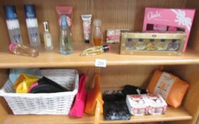 2 shelves of toiletries etc., including Yankee candles, cosmetic cases etc.