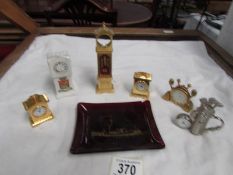 A quantity of miniature brass clocks etc.