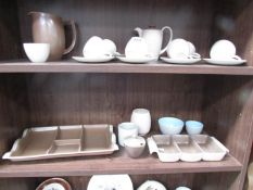 A quantity of Poole pottery tea ware.