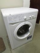 An Indesit washing machine (sold as seen).