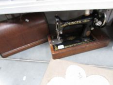 A cased Singer sewing machine,.