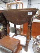 A small oak drop side table.