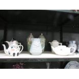 A mixed lot including teapots, jugs and pair of lidded stork vases,.