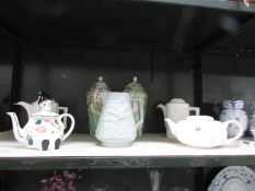 A mixed lot including teapots, jugs and pair of lidded stork vases,.