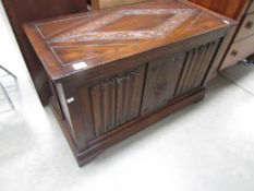 An oak blanket box.