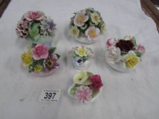 A quantity of porcelain posies including Aynsley, Royal Doulton and Coalport.