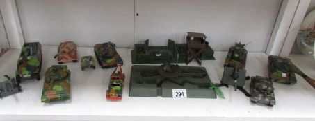 A collection of die cast military vehicles including tanks.