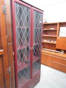 A modern glazed bookcase.