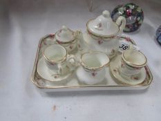 A miniature china tea set.