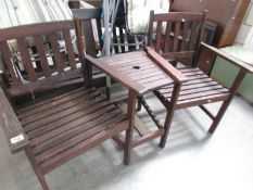 A 2 person garden seat with centre table.