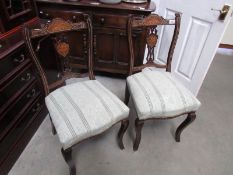 A pair of Victorian inlaid chairs.