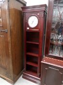 A modern Grandfather clock/book case.