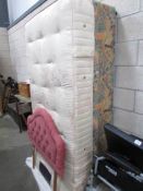 A single divan bed with mattress and headboard.
