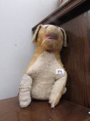 A vintage toy dog, distressed.