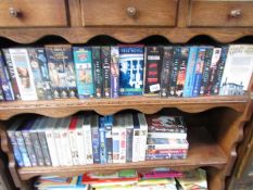 2 shelves of videos.