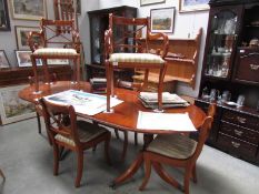 An extending dining table and 6 chairs.