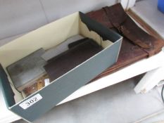 An old leather briefcase and with an assortment of military ephemera including Board of Trade