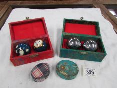 2 boxed sets of oriental stress balls and 2 pin boxes.