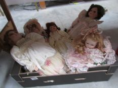 A quantity of porcelain collector's dolls.