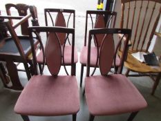 A set of 4 modern dining chairs.