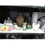 A shelf of vases etc.