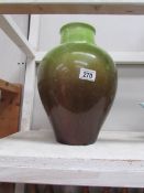 A large green pottery vase,