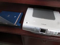 A Lexmark printer and a guillotine.