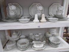 Approximately 70 piece of Johnson Bros., Eternal Beau table ware. (2 shelves).
