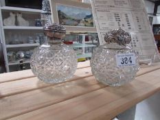 2 cut glass silver topped scent bottles, tops a/f.