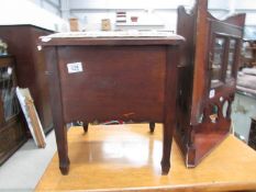 A mahogany commode complete with pot liner.