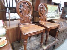 A pair of Victorian hall chairs, a/f.