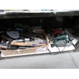 A shelf of assorted tools,
