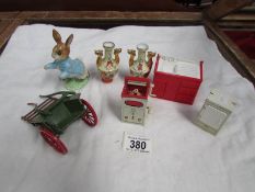 A die cast hay cart, a Peter rabbit figurine,