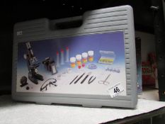 A cased microscope set.