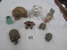 6 frog figures and 2 tortoises.