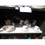 A shelf of miscellaneous china including Johnson's.