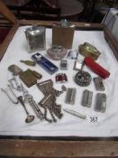 A mixed lot including hip flasks, lighters etc.