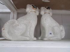A pair of large Staffordshire spaniels.