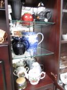 A mixed lot of old teapots, jugs etc.