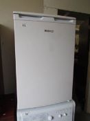 A Beki fridge with freezer compartment.