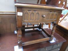 An oak single drawer side table.