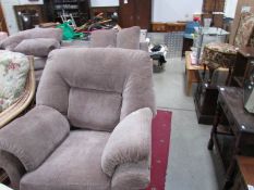 A 3 seat beige sofa and matching chair.