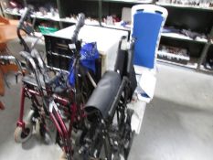 A wheelchair, 2 walking aids and a bath lift.