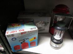 A boxed electric sander, camping stove and 2 lanterns.