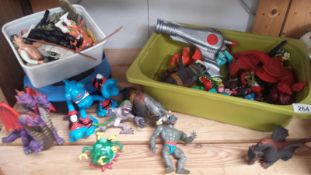 A collection of toys and figures including He Man, Dragons, Monsters etc.