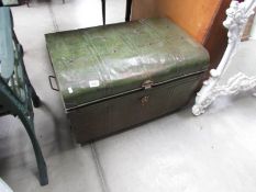 A large old tin trunk.