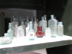 A collection of assorted glass bottles.